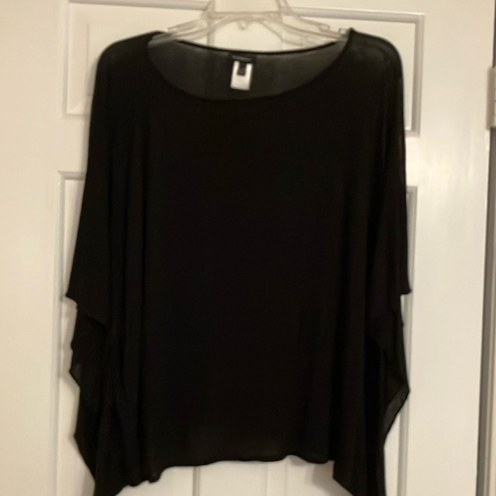 Black Talbots top in soft rayon that falls loosely by hips